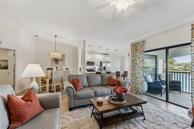 9517 Avellino Way Unit 2224, Naples, FL 34113 - living room featuring ceiling fan, light tile patterned floors, and crown molding