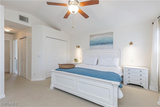 bedroom with visible vents, baseboards, light colored carpet, vaulted ceiling, and a ceiling fan