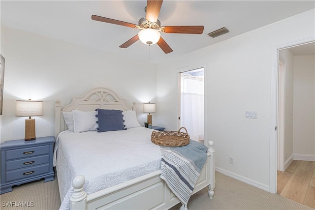 bedroom with baseboards, visible vents, and ceiling fan