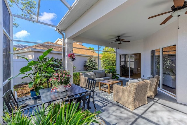 view of patio featuring ceiling fan, a lanai, and an outdoor hangout area