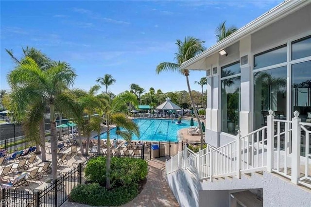 pool featuring a patio and fence