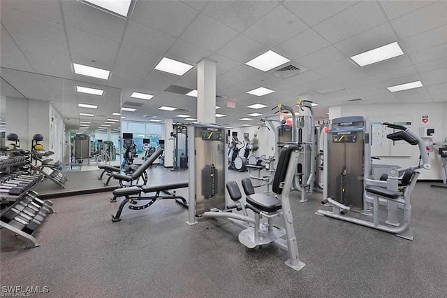 gym with a drop ceiling and visible vents