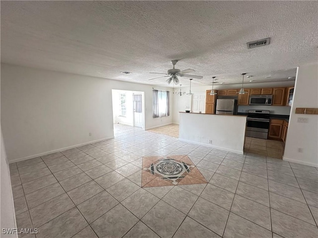 unfurnished living room featuring light tile patterned floors, a textured ceiling, and ceiling fan