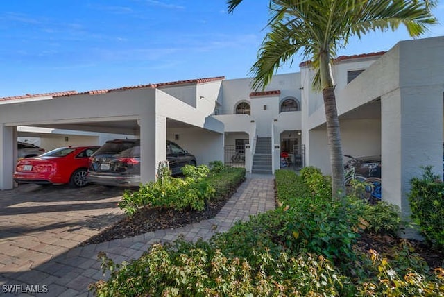 mediterranean / spanish house with a carport