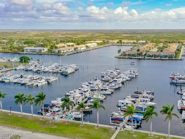 birds eye view of property with a water view