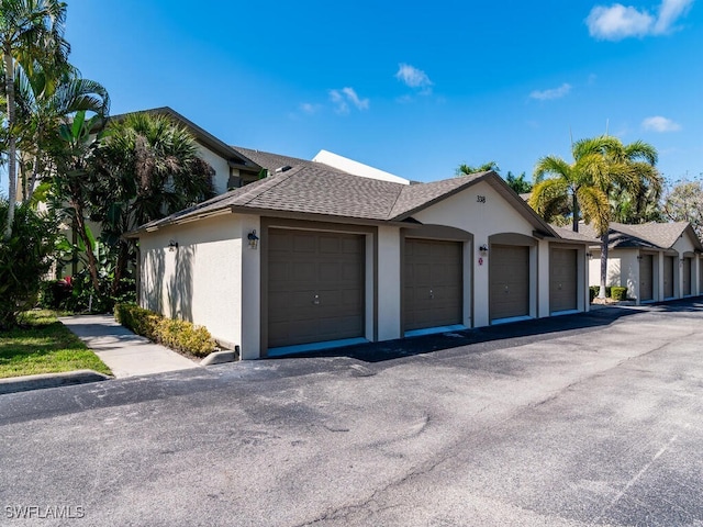 single story home featuring a garage