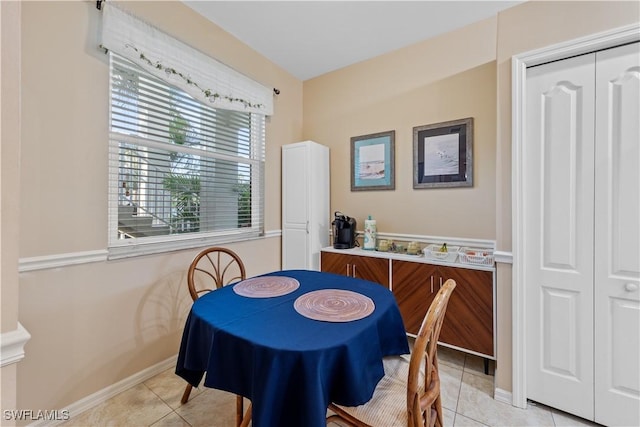 dining area featuring light tile patterned floors