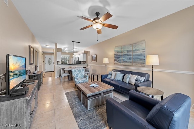 tiled living room featuring ceiling fan