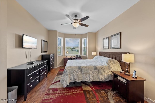 bedroom featuring dark hardwood / wood-style floors and ceiling fan