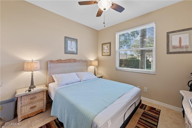 bedroom with ceiling fan and light tile patterned floors