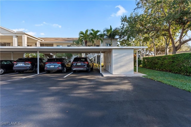 view of vehicle parking featuring a carport