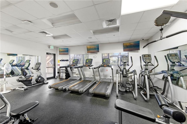 gym featuring a drop ceiling