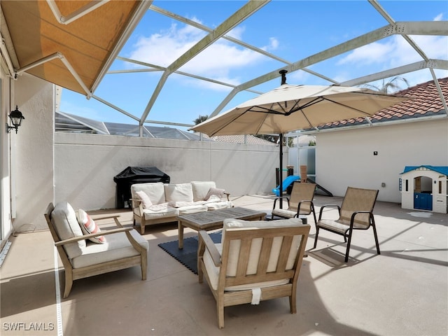 view of patio / terrace with fence, a lanai, an outdoor living space, and a grill