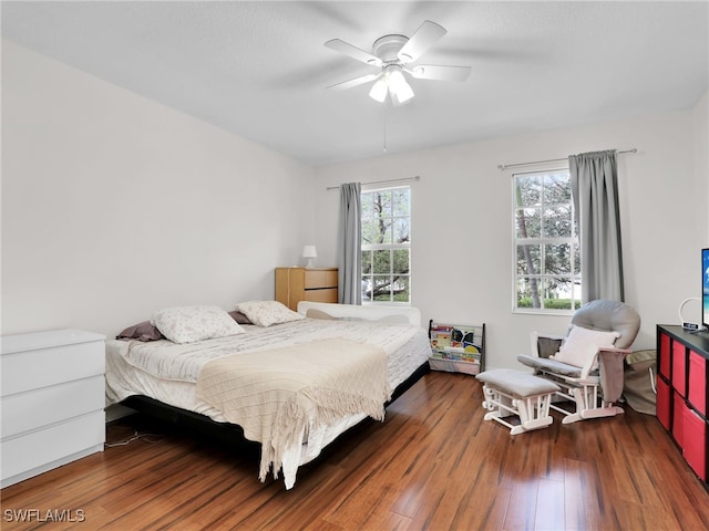 bedroom with dark wood finished floors and ceiling fan