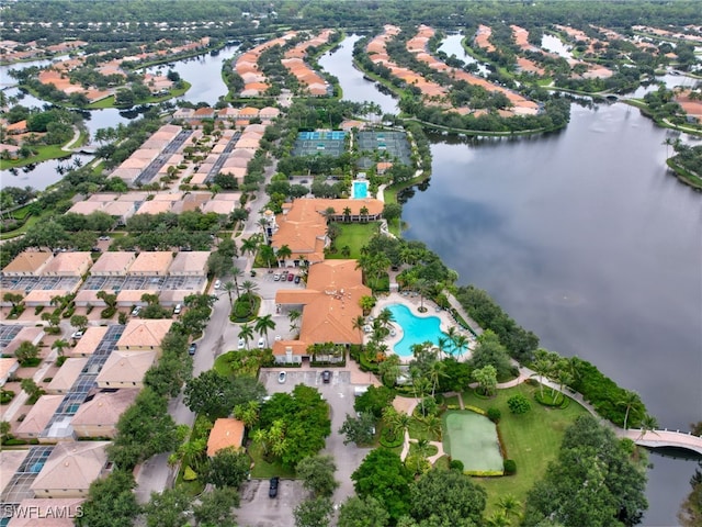 birds eye view of property with a residential view and a water view