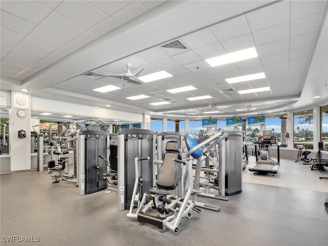 gym with a drop ceiling and visible vents