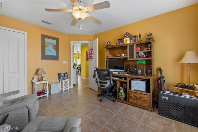 home office featuring ceiling fan and light tile patterned floors