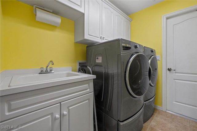 clothes washing area with cabinets, separate washer and dryer, sink, and light tile patterned floors