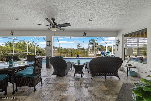 sunroom / solarium with ceiling fan