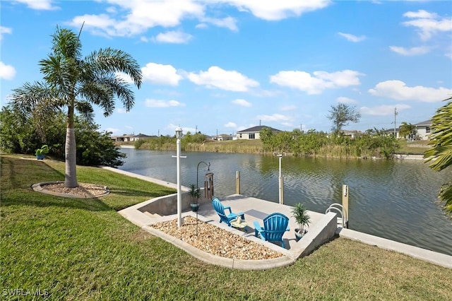 dock area featuring a water view and a yard