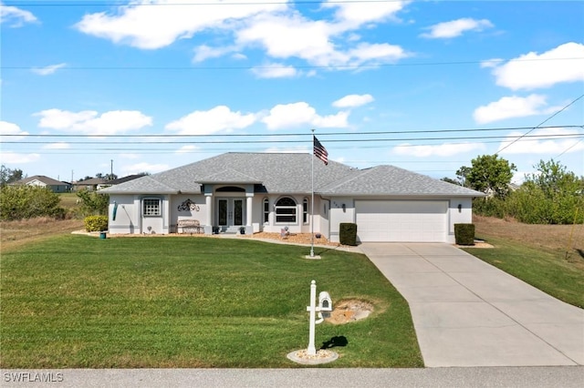 view of front of home with a garage, a front yard, and french doors