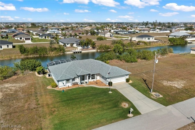 drone / aerial view with a water view