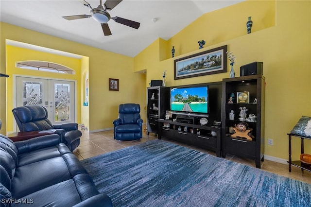 living room with lofted ceiling, tile patterned floors, french doors, and ceiling fan