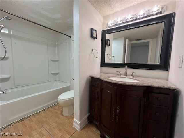 full bathroom with vanity, shower / tub combination, toilet, and a textured ceiling