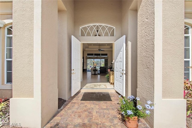 view of exterior entry featuring stucco siding