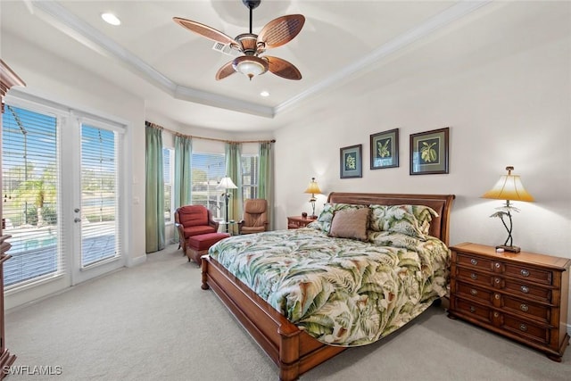 bedroom with recessed lighting, light carpet, access to exterior, ornamental molding, and a tray ceiling