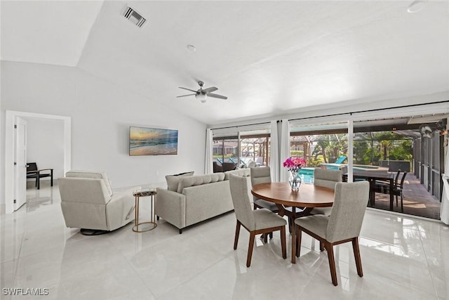 dining space with vaulted ceiling, a sunroom, visible vents, and a ceiling fan