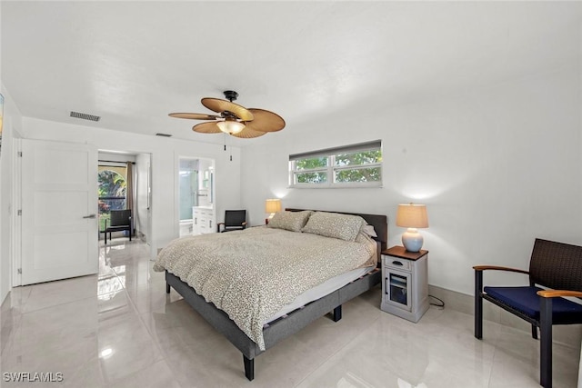 bedroom featuring a ceiling fan, connected bathroom, visible vents, and baseboards