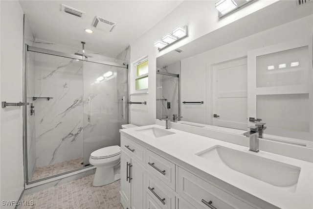 full bathroom with a marble finish shower, visible vents, and a sink