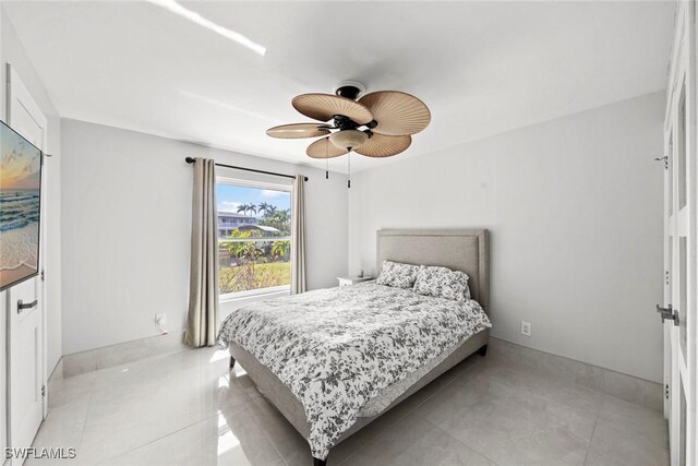 bedroom featuring ceiling fan and light tile patterned floors