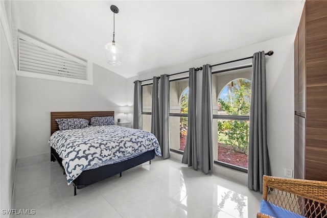 bedroom featuring lofted ceiling