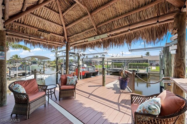 view of dock with a water view and boat lift