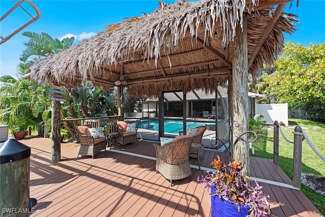 deck with a gazebo and a fenced in pool