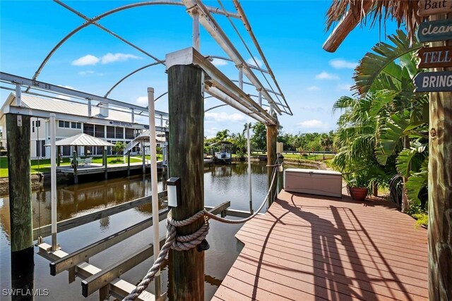 dock area featuring a water view and boat lift