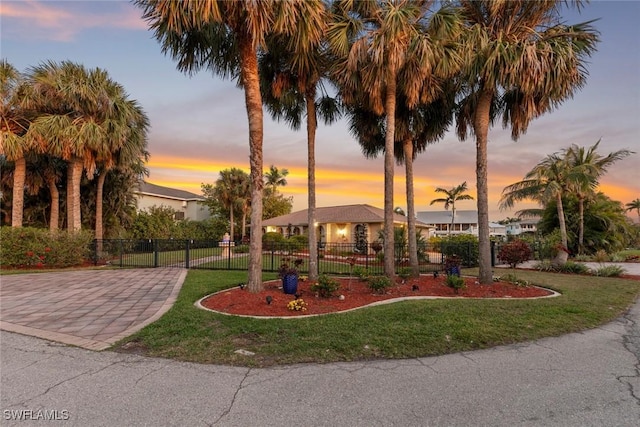 view of front of property with a yard and a fenced front yard