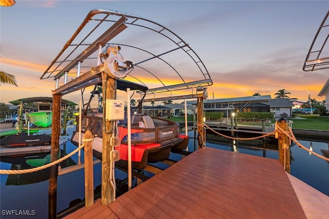 view of dock with a water view and boat lift