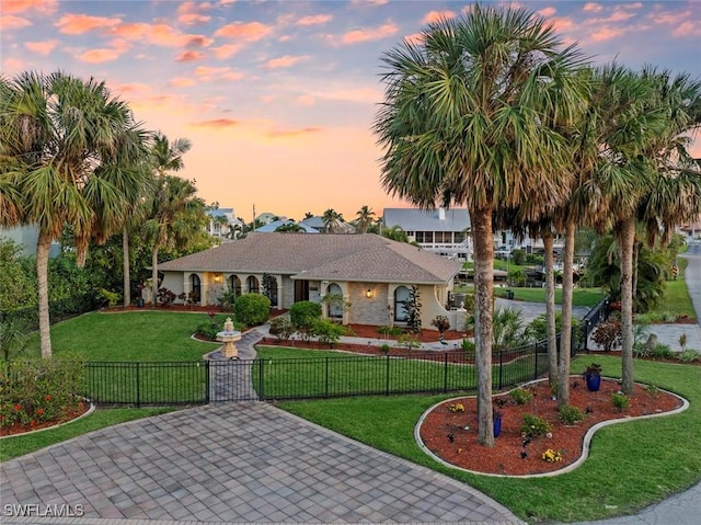 view of front of home featuring a fenced front yard and a front yard