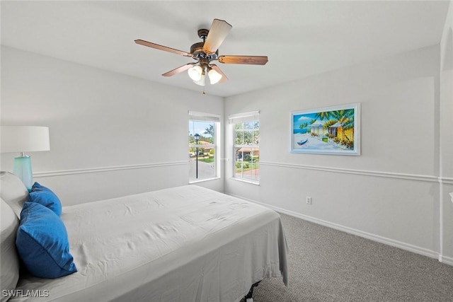 bedroom featuring carpet flooring, a ceiling fan, and baseboards