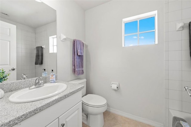 full bathroom with a wealth of natural light, vanity, toilet, and tile patterned floors