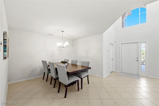 dining area featuring baseboards, light tile patterned floors, visible vents, and an inviting chandelier