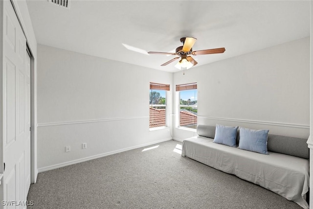 carpeted bedroom with a closet, visible vents, a ceiling fan, access to outside, and baseboards