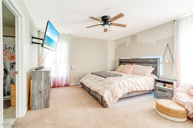 bedroom with ceiling fan and carpet floors