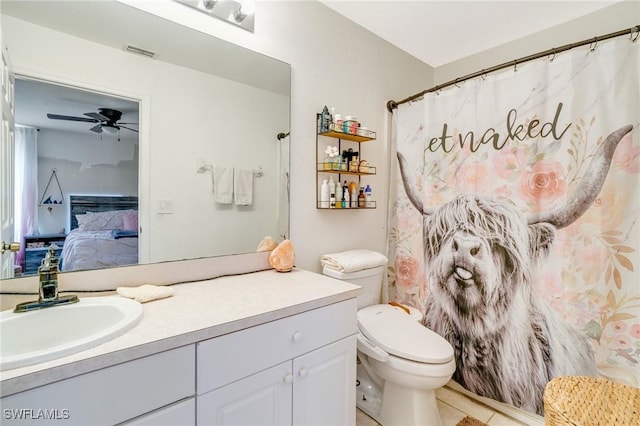 ensuite bathroom with visible vents, toilet, ensuite bathroom, a ceiling fan, and vanity