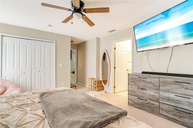 bedroom with ceiling fan, visible vents, a closet, and carpet flooring