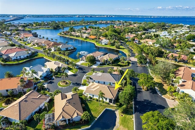 drone / aerial view with a water view