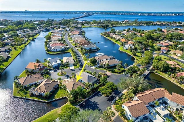 aerial view featuring a water view and a residential view